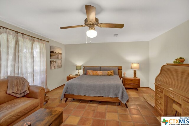 bedroom featuring light tile patterned flooring and ceiling fan