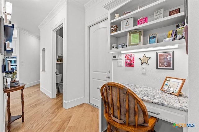 1605 Altavista Loop, Temple, TX 76502 - office with crown molding, light wood-style floors, built in desk, and baseboards