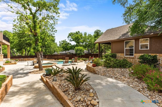 1605 Altavista Loop, Temple, TX 76502 - fenced backyard with a patio and a pool with connected hot tub