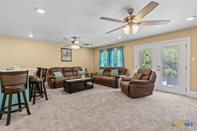 1605 Altavista Loop, Temple, TX 76502 - living room featuring light colored carpet, french doors, a ceiling fan, and recessed lighting