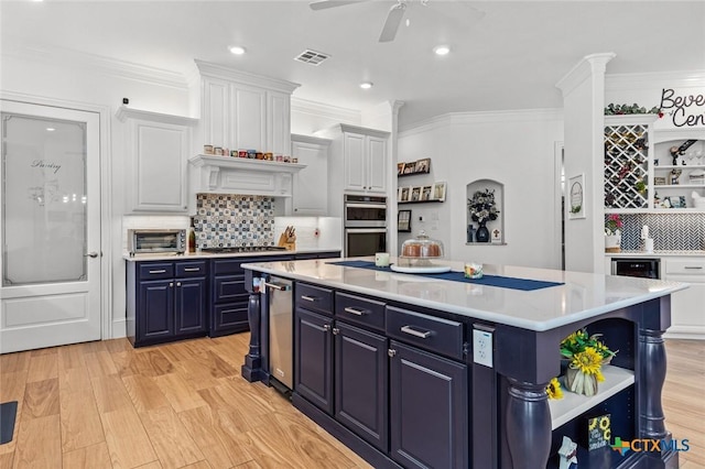 1605 Altavista Loop, Temple, TX 76502 - kitchen with open shelves, blue cabinetry, light countertops, decorative backsplash, and recessed lighting