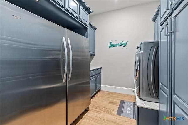 1605 Altavista Loop, Temple, TX 76502 - kitchen featuring built in refrigerator, light wood-style floors, washer / clothes dryer, and baseboards