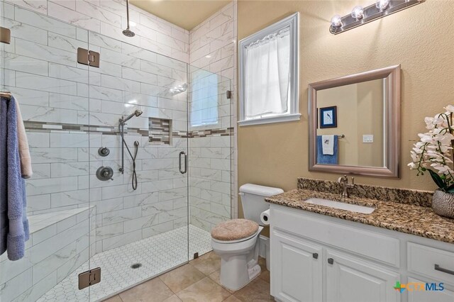 1605 Altavista Loop, Temple, TX 76502 - full bath with a stall shower, vanity, toilet, and tile patterned flooring