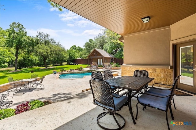 1605 Altavista Loop, Temple, TX 76502 - view of patio featuring outdoor dining area, an outdoor structure, and view of wooded area