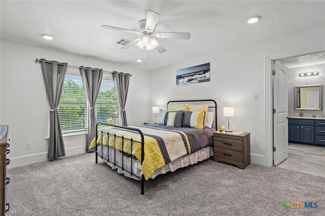 1605 Altavista Loop, Temple, TX 76502 - bedroom with light carpet, baseboards, ensuite bathroom, ceiling fan, and recessed lighting