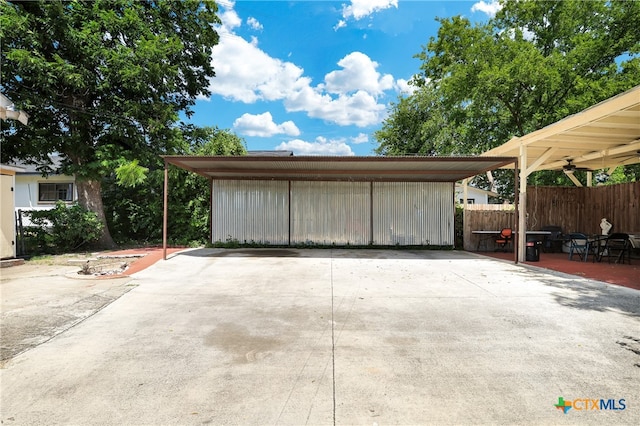 garage featuring a carport