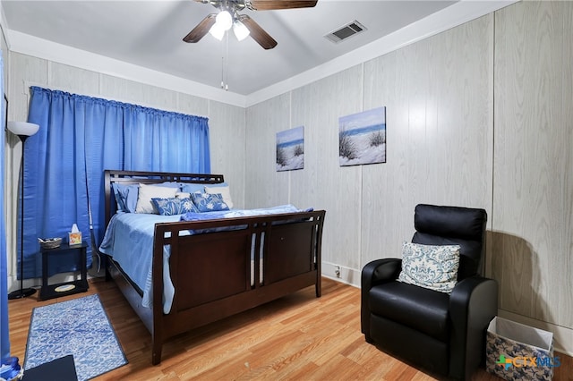 bedroom with hardwood / wood-style flooring and ceiling fan