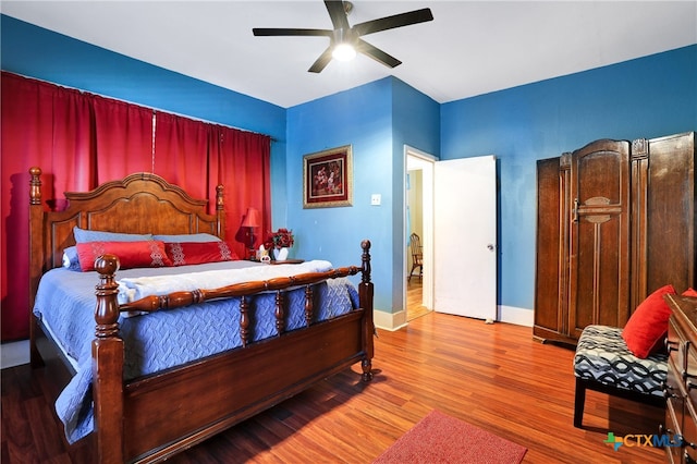 bedroom featuring wood-type flooring and ceiling fan