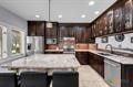 kitchen featuring dark brown cabinets