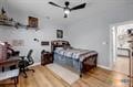 bedroom with hardwood / wood-style flooring and ceiling fan