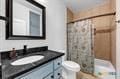 bathroom with vanity and shower / bath combo with shower curtain