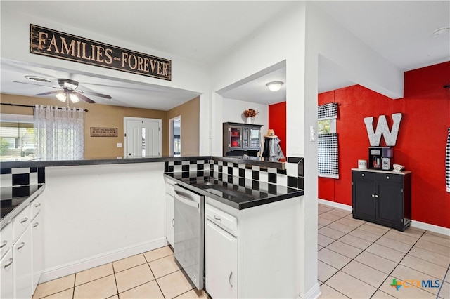 kitchen with ceiling fan, white cabinetry, light tile patterned floors, and decorative backsplash