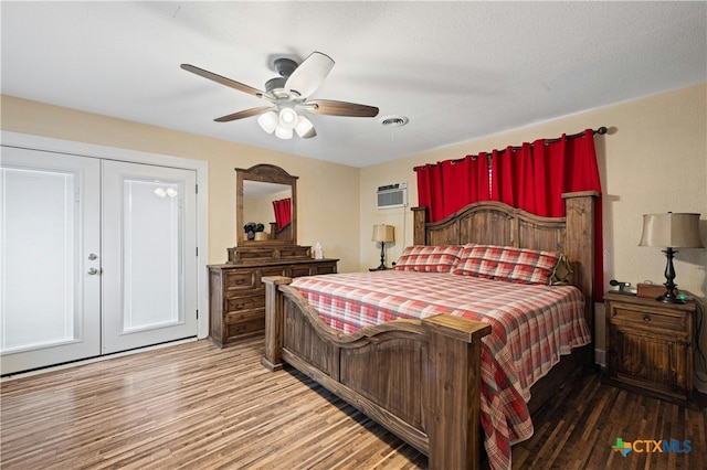 bedroom with french doors, hardwood / wood-style floors, ceiling fan, and a closet