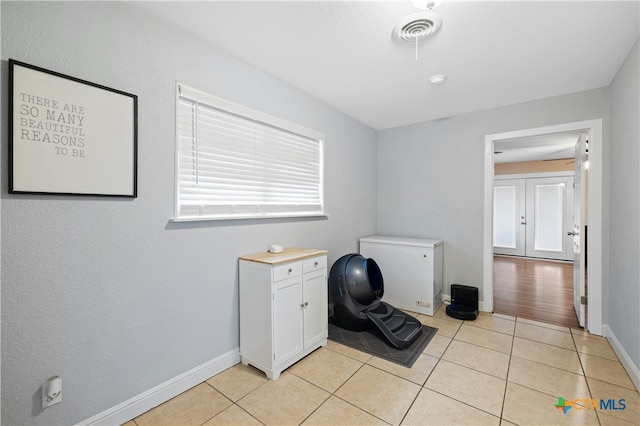 interior space with light tile patterned floors