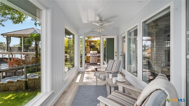 sunroom / solarium with ceiling fan