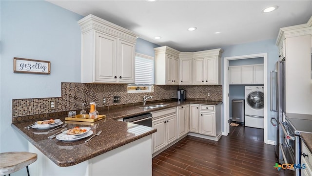 kitchen with kitchen peninsula, white cabinetry, dark hardwood / wood-style flooring, and decorative backsplash