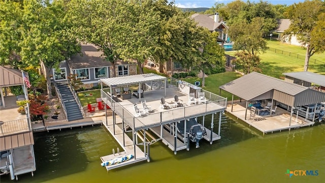 view of dock featuring a yard and a water view