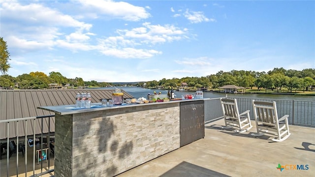 view of patio / terrace with a water view