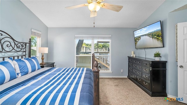 carpeted bedroom featuring a textured ceiling, ceiling fan, and lofted ceiling