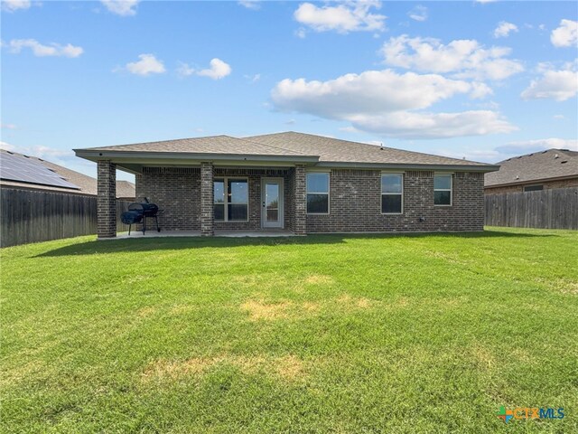 5205 Colina Dr, Killeen, TX 76549 - rear view of house featuring brick siding, a patio, and a shingled roof
