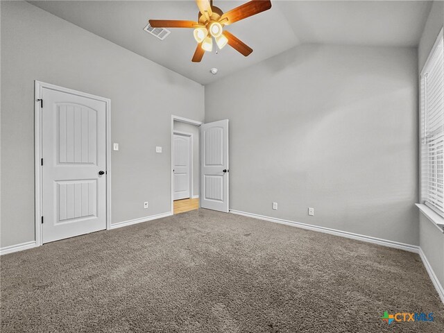 5205 Colina Dr, Killeen, TX 76549 - unfurnished bedroom featuring carpet floors, baseboards, ceiling fan, and high vaulted ceiling