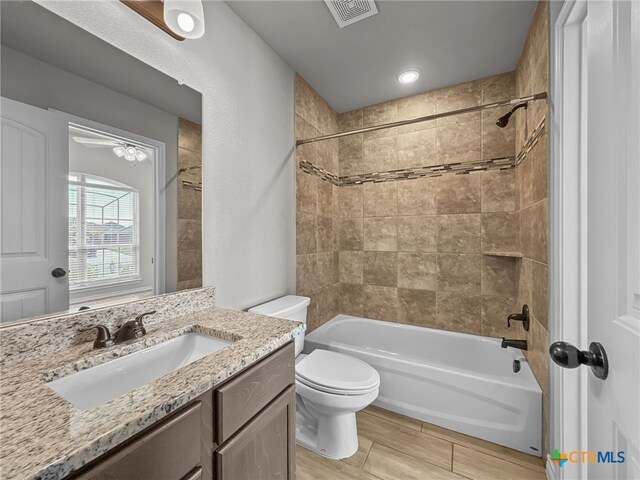 5205 Colina Dr, Killeen, TX 76549 - bathroom featuring vanity, toilet, shower / bath combination, and wood finished floors