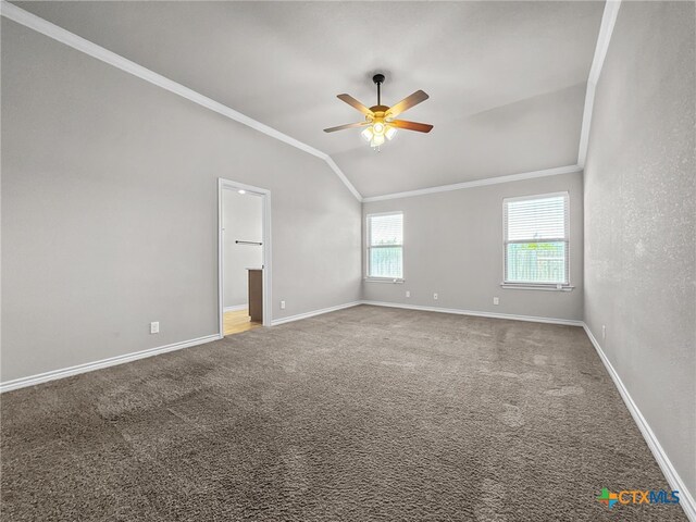 5205 Colina Dr, Killeen, TX 76549 - empty room featuring ornamental molding, a ceiling fan, vaulted ceiling, baseboards, and carpet flooring