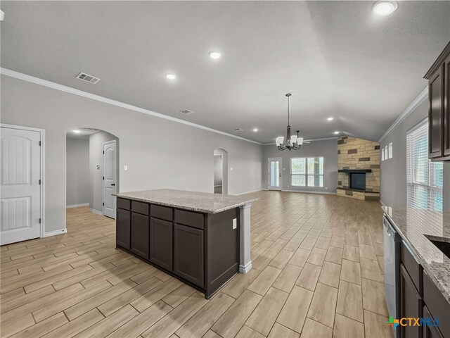 5205 Colina Dr, Killeen, TX 76549 - kitchen with ornamental molding, light wood-type flooring, arched walkways, a chandelier, and baseboards