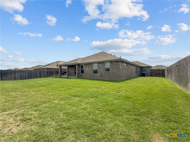5205 Colina Dr, Killeen, TX 76549 - rear view of property featuring brick siding and roof with shingles