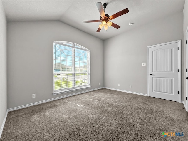 5205 Colina Dr, Killeen, TX 76549 - empty room featuring a ceiling fan, vaulted ceiling, carpet, and baseboards