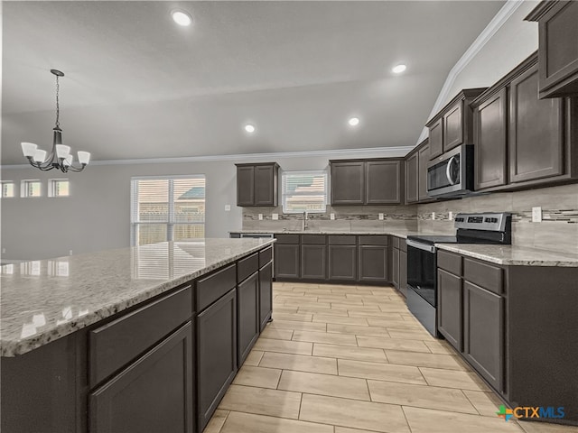 5205 Colina Dr, Killeen, TX 76549 - kitchen featuring appliances with stainless steel finishes, crown molding, tasteful backsplash, a chandelier, and light stone countertops
