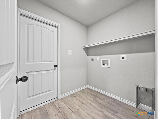 5205 Colina Dr, Killeen, TX 76549 - washroom featuring electric dryer hookup, hookup for a washing machine, baseboards, and wood finished floors
