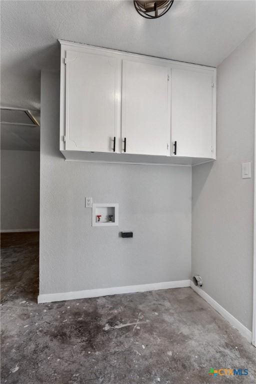 laundry room featuring washer hookup and cabinets