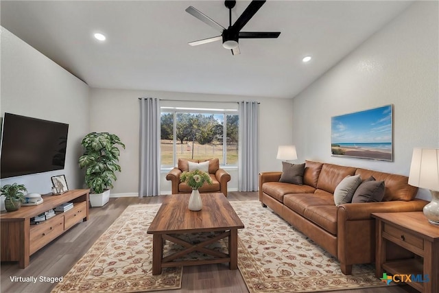 living room with vaulted ceiling, dark wood-type flooring, and ceiling fan