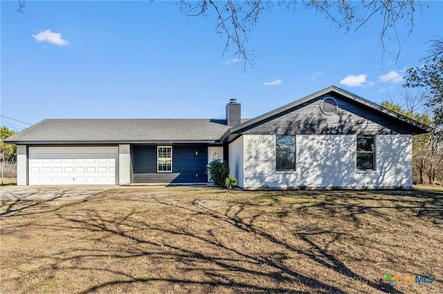 ranch-style home with a front lawn and a garage