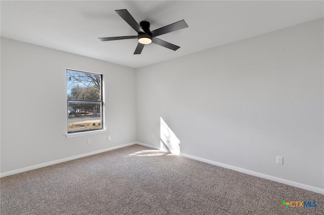 empty room with ceiling fan and carpet