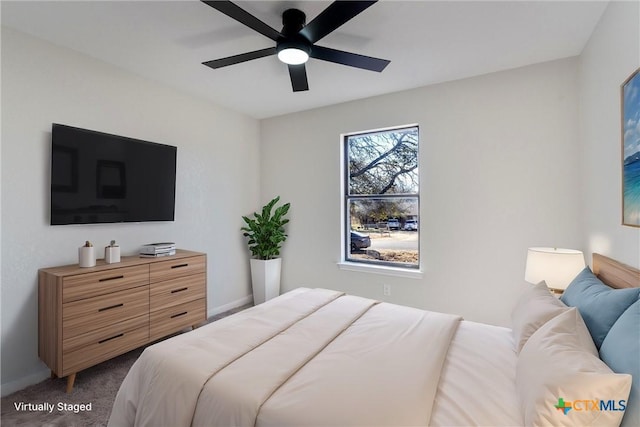 carpeted bedroom with ceiling fan