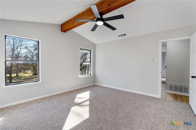 unfurnished room featuring ceiling fan, carpet, and lofted ceiling with beams