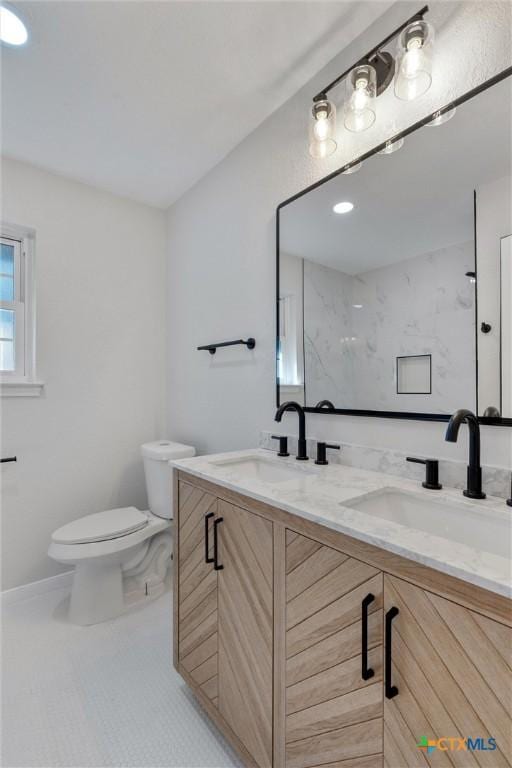 bathroom with toilet, tile patterned flooring, a shower, and vanity