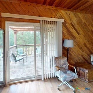 501 Live Oak St, Gatesville, TX 76528 - entryway featuring wooden walls, wood ceiling, and wood finished floors