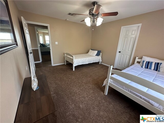 carpeted bedroom featuring ceiling fan