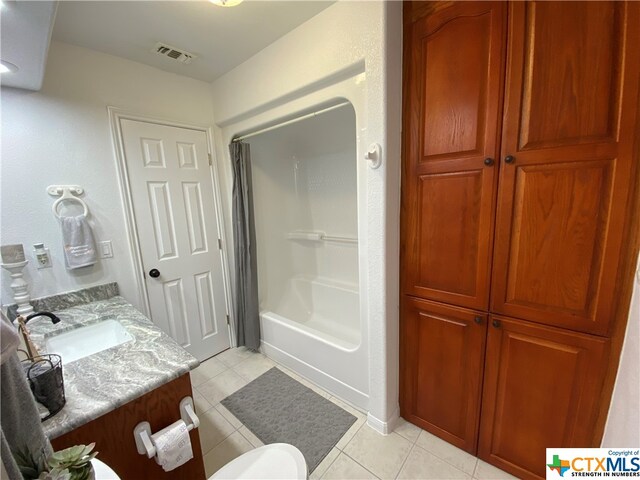 bathroom with vanity,  shower combination, and tile patterned floors