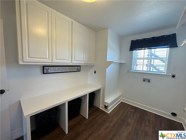 laundry room with cabinets, hookup for a washing machine, dark hardwood / wood-style floors, and electric dryer hookup