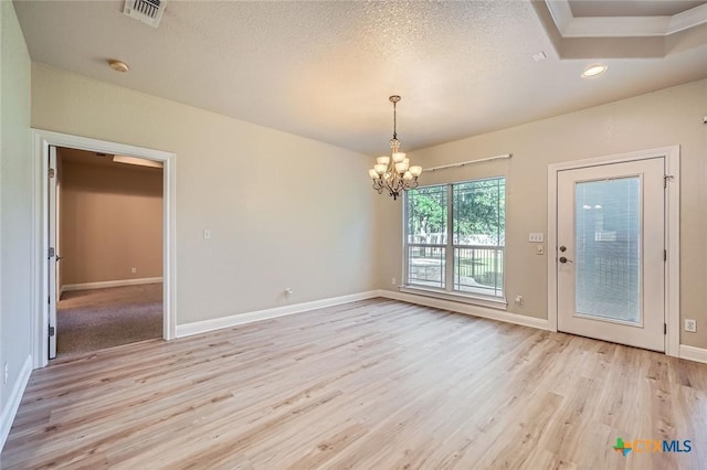 240 Hummingbird Way, Martindale, TX 78655 - spare room with a chandelier, light wood-style floors, baseboards, recessed lighting, and a textured ceiling