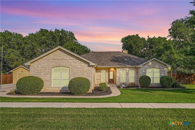 240 Hummingbird Way, Martindale, TX 78655 - ranch-style house with stone siding, a shingled roof, and a chimney