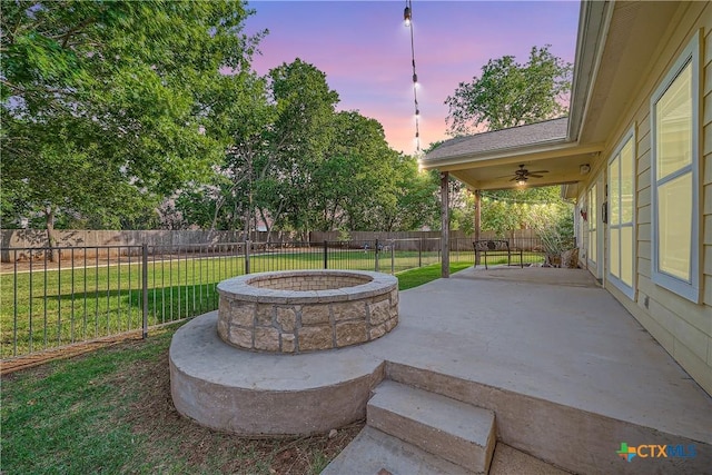 240 Hummingbird Way, Martindale, TX 78655 - patio terrace at dusk with a fire pit, ceiling fan, and a patio