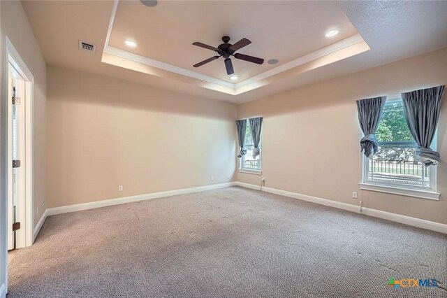 240 Hummingbird Way, Martindale, TX 78655 - carpeted empty room featuring a tray ceiling, ceiling fan, recessed lighting, baseboards, and ornamental molding