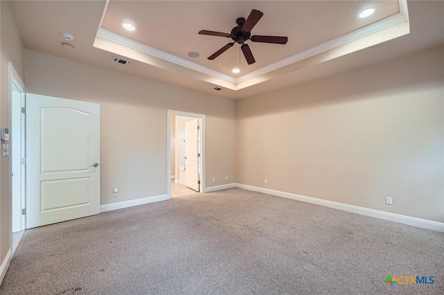 240 Hummingbird Way, Martindale, TX 78655 - unfurnished room featuring a raised ceiling, ornamental molding, a ceiling fan, light colored carpet, and recessed lighting