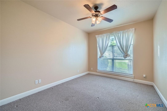 240 Hummingbird Way, Martindale, TX 78655 - spare room with light carpet, baseboards, and ceiling fan
