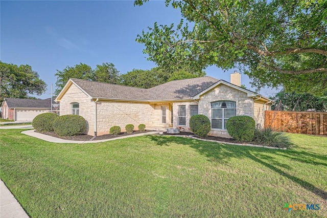 240 Hummingbird Way, Martindale, TX 78655 - ranch-style house with stone siding and a chimney